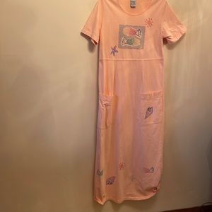 Ladies cotton long Beach dress in coral with sea shells.